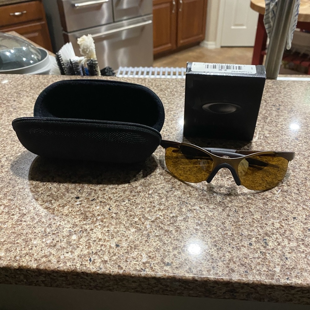 Oakley sunglasses with case and nose piece